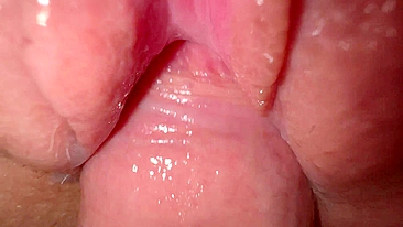 Sexy young girl with incredibly tight and creamy pussy in close-up shot.