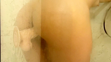 Teen mom plays with her own milk-filled breasts and dildo during steamy shower session.