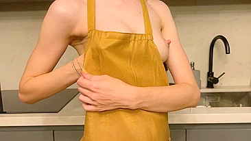 A young mother displays her petite, unaugmented breasts in a natural state, suitable for viewing by mature audiences on an adult website.