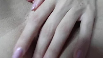 Sexy teen masturbates with spread pussy in close-up shot.