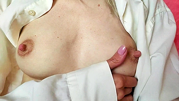 Sexy lactating mother pleasuring her breasts in erotic play.