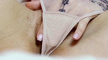 Sexy close-up shot of a woman masturbating with her pussy.