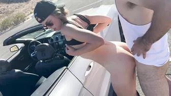 A wife is double-teamed by two guys and gets a cream pie on a public road in the Nevada desert.