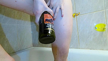 Sultry teen enjoys ginger wine and gets horny with bottle action.