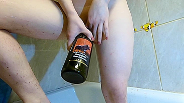Sultry teen enjoys ginger wine and gets horny with bottle action.