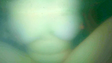 Fingering red hair pussy while teasing big natural breasts underwater in a bath.