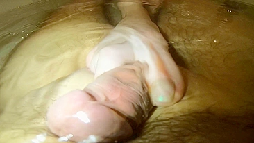 Underwater footjob cumshot ginger teen rubbing cock with feet until orgasm.