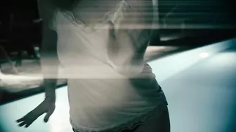 Redheaded girl dancing nude in rain with big natural breasts.