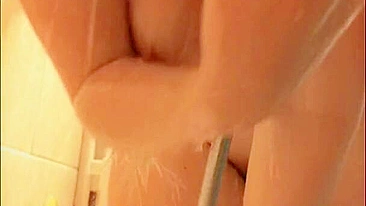 Gorgeous busty woman showers with round ass and cum shot.