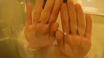 Girl plays with her big natural boobs and large fit ass in hot shower.