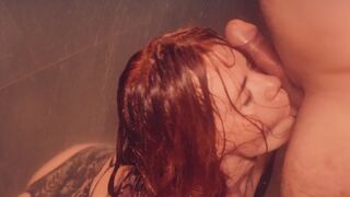 Red-haired beauty gives long, sensuous blowjob and worships cock in hot shower.