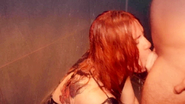 Red-haired beauty gives long, sensuous blowjob and worships cock in hot shower.