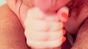Caught in the act of giving her boyfriend a sloppy blowjob with cum dripping down her big tits.