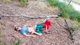 Poison Ivy kisses Batman while riding him in a forest lake until he creams her pussy.