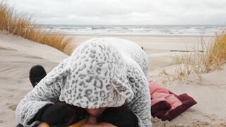 Red-haired amateur enjoys cold winter beach blowjob and swallows cum in a public setting.