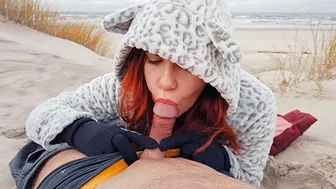 Red-haired amateur enjoys cold winter beach blowjob and swallows cum in a public setting.