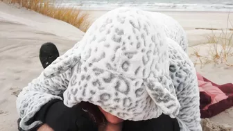Red-haired amateur enjoys cold winter beach blowjob and swallows cum in a public setting.