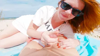 Red-haired woman flashes and performs oral sex on beach before receiving a large cum shot in public. Red-haired woman flashes and performs oral sex on beach before receiving a large cum shot in public.