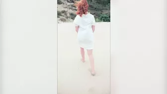 Redhead in white dress flashes and blows at risky public beach; cumshot ensues.