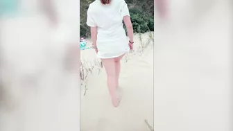 Redhead in white dress flashes and blows at risky public beach; cumshot ensues.