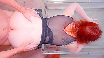 Redhead with big natural tits licking creampie on glass table.