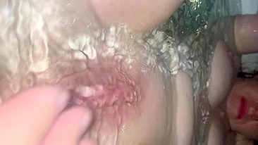 Underwater ginger pussy fingering and footjob with extreme closeups and creampie.