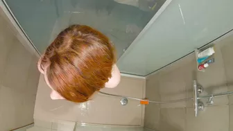 This steamy shower scene features a curvy redhead teen getting hard and wet doggy-style.