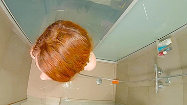 This steamy shower scene features a curvy redhead teen getting hard and wet doggy-style.