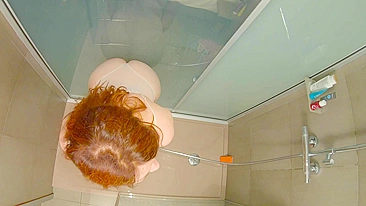 This steamy shower scene features a curvy redhead teen getting hard and wet doggy-style.