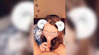 A redhead in glasses sucks cock until she orgasms on camera.