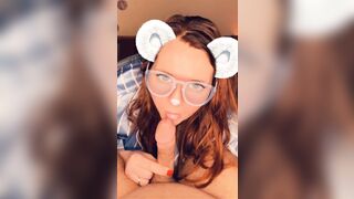 A redhead in glasses sucks cock until she orgasms on camera.