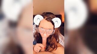 A redhead in glasses sucks cock until she orgasms on camera.