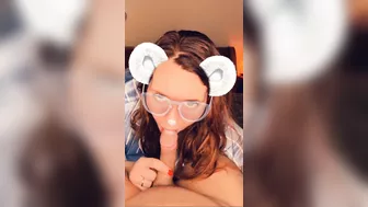 A redhead in glasses sucks cock until she orgasms on camera.