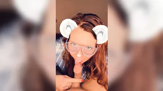 A redhead in glasses sucks cock until she orgasms on camera.
