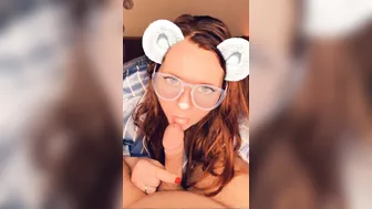 A redhead in glasses sucks cock until she orgasms on camera.
