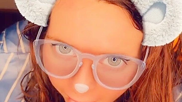 A redhead in glasses sucks cock until she orgasms on camera.
