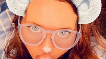 A redhead in glasses sucks cock until she orgasms on camera.