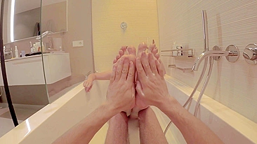 Big titted ginger redhead foot slave enjoys sensual feet spa and toe job while smoking in a bath tub.