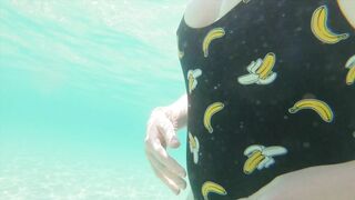 Risky beach handjob underwater cumshot with curvy redhead.