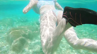 Curvy redhead gets risky handjob on public beach with big tits and cumshot.