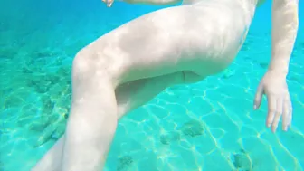 Curvy ginger teen swims nude and pees in sea.