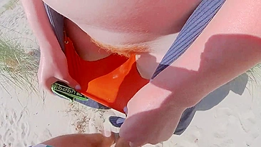 Strangers caught my wife in her swimsuit panties on a public beach. She has big tits and a hairy pussy.