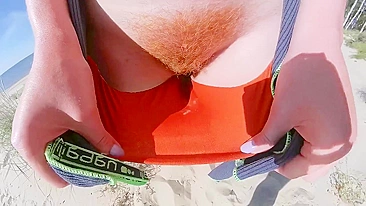 Strangers caught my wife in her swimsuit panties on a public beach. She has big tits and a hairy pussy.