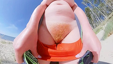 Strangers caught my wife in her swimsuit panties on a public beach. She has big tits and a hairy pussy.