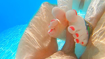 Seduced by a ginger mermaid in an underwater footjob, perfect soles with long red nails.
