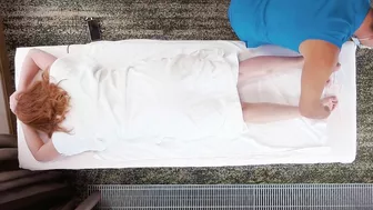 Redhead milf with big boobs gets an oil massage that ends in a creamy pussy licking and hairy pussy cumshot.