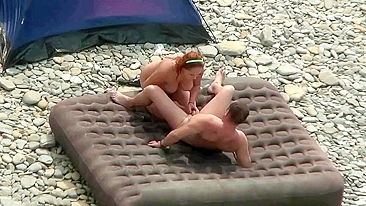 Beach fuck scene showing spy cam action with a horny mature couple of fuckers