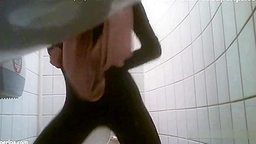 European stepsister looks hot while pissing in front of the camera in spycam XXX