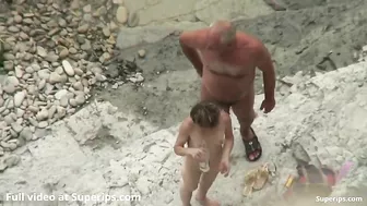 Granny fucking her stepbrother in a public beach spy cam XXX scene with riding