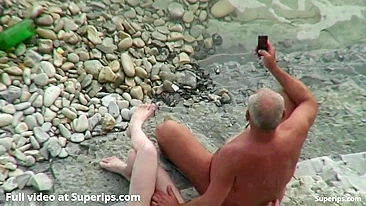 Granny fucking her stepbrother in a public beach spy cam XXX scene with riding